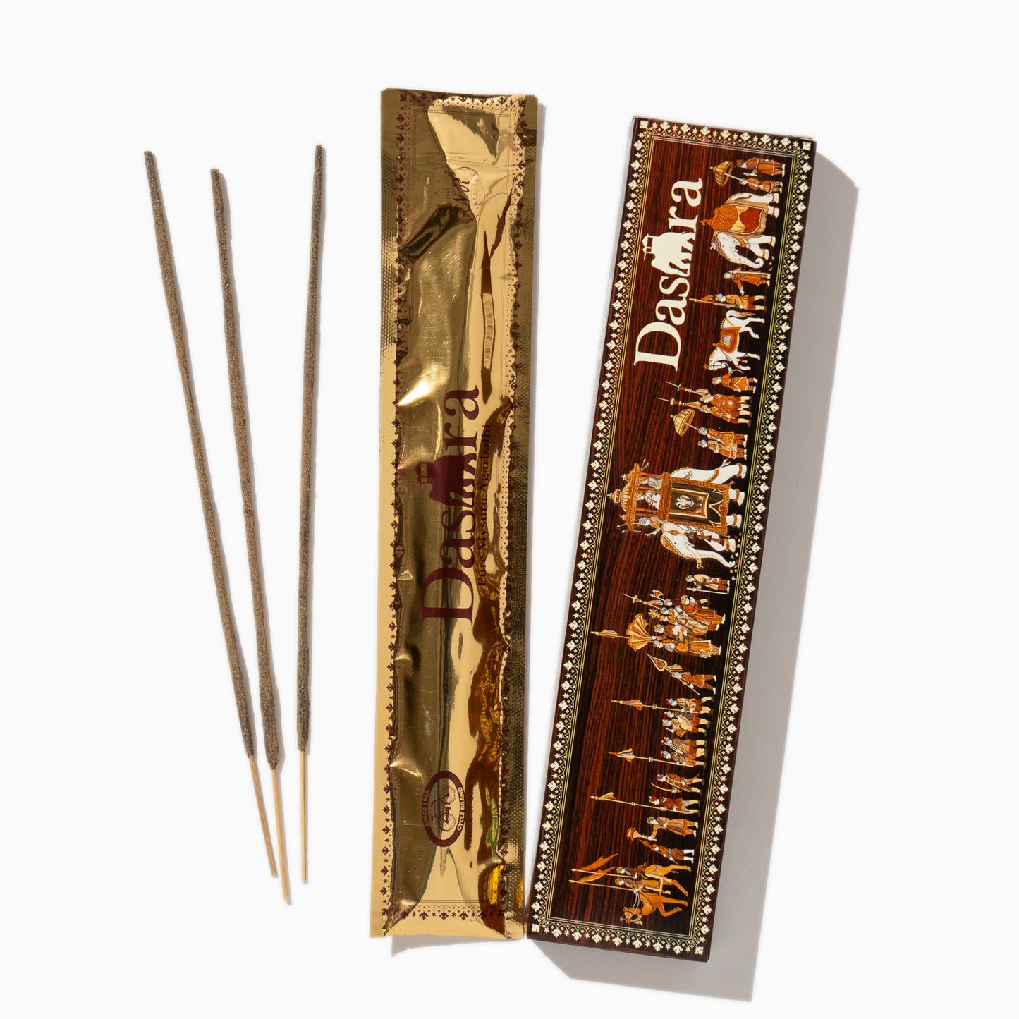 open pack of box of Dasara Cycle Indian incense sticks on white background