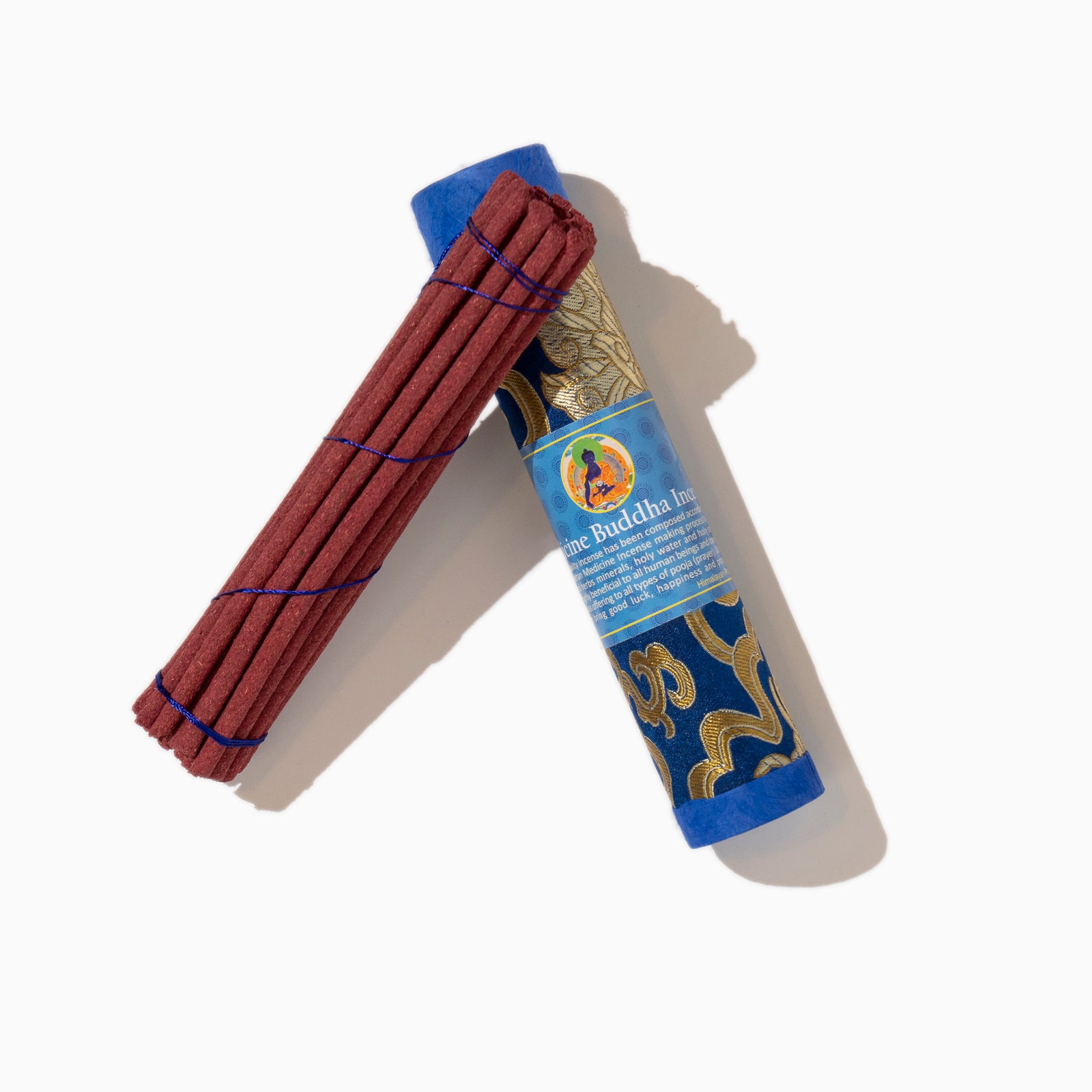 open box of Medicine Buddha Tibetan incense sticks on white background