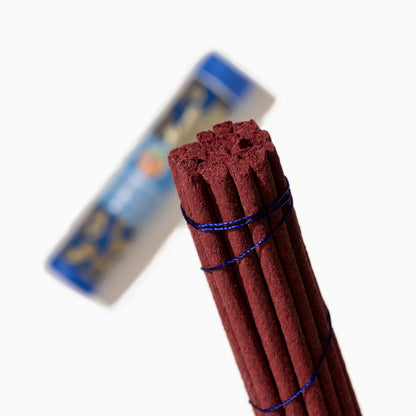 detail of box of Medicine Buddha Tibetan incense sticks on white background