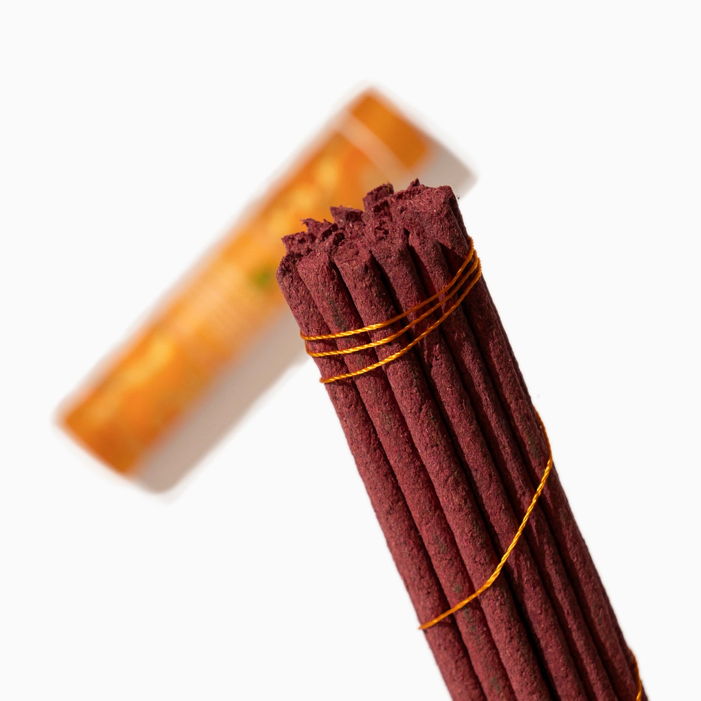 detail box of Meditation Tibetan incense sticks on white background