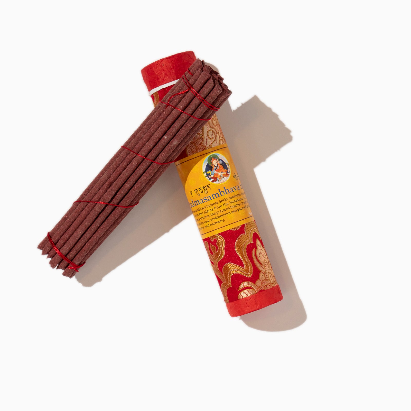 oped box of Padmasambhava Tibetan incense sticks on white background